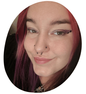 Picture of a smiling woman with eyeliner and piercings in a circle.